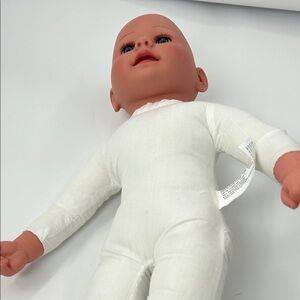 Realistic Baby Doll with White Outfit